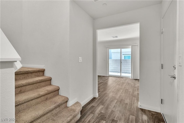 6952 Crescent Gold St, North Las Vegas, NV 89086 - staircase with wood finished floors and baseboards