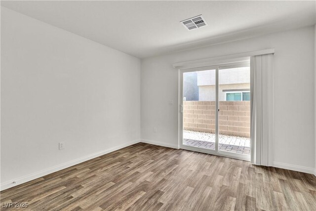 6952 Crescent Gold St, North Las Vegas, NV 89086 - empty room with wood finished floors and baseboards