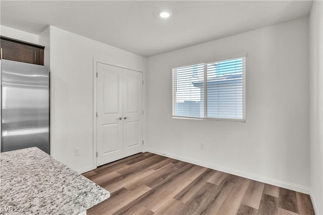 6952 Crescent Gold St, North Las Vegas, NV 89086 - unfurnished dining area featuring wood finished floors, baseboards, and recessed lighting