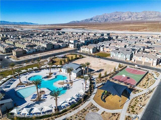 6952 Crescent Gold St, North Las Vegas, NV 89086 - aerial perspective of suburban area featuring mountains and a pool