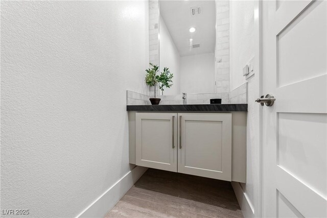 2820 High Range Dr, Las Vegas, NV 89134 - bathroom featuring vanity, wood finished floors, and baseboards