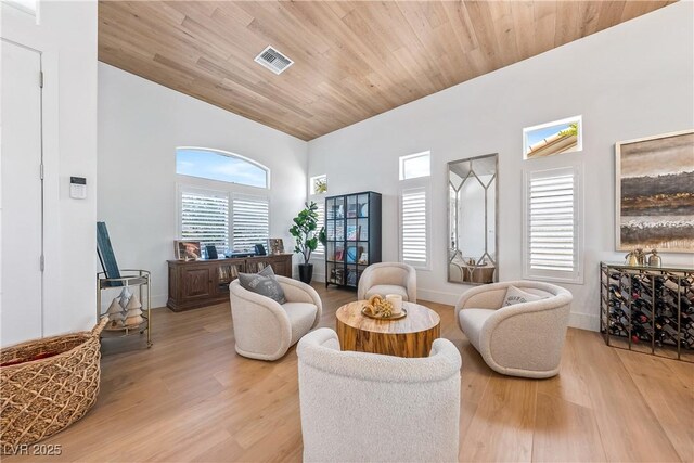 2820 High Range Dr, Las Vegas, NV 89134 - living area featuring light wood finished floors, a towering ceiling, and wood ceiling