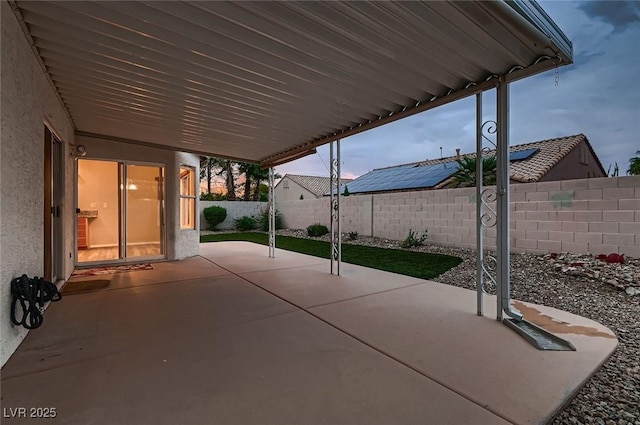 3426 Side Saddle Ct, North Las Vegas, NV 89032 - patio terrace at dusk with a patio and a fenced backyard