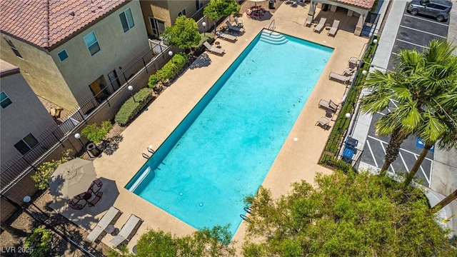 7694 Hampton Park Ln, Las Vegas, NV 89113 - community pool featuring a patio area