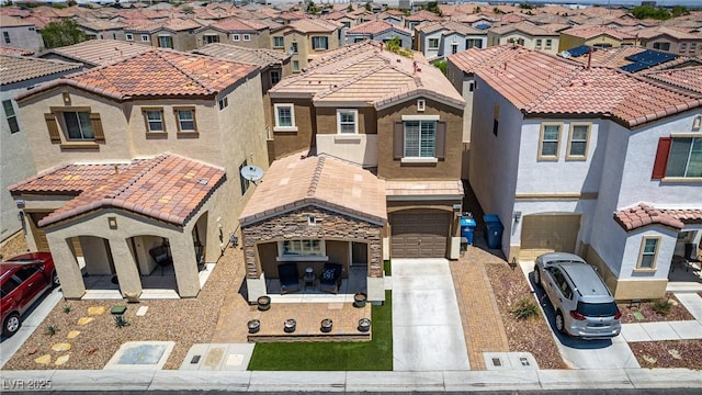 7694 Hampton Park Ln, Las Vegas, NV 89113 - view of front facade featuring a residential view, a garage, concrete driveway, and stucco siding