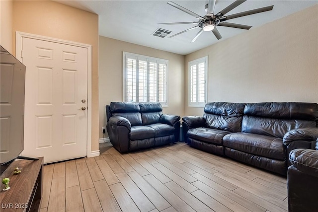7694 Hampton Park Ln, Las Vegas, NV 89113 - living room with ceiling fan and light wood finished floors