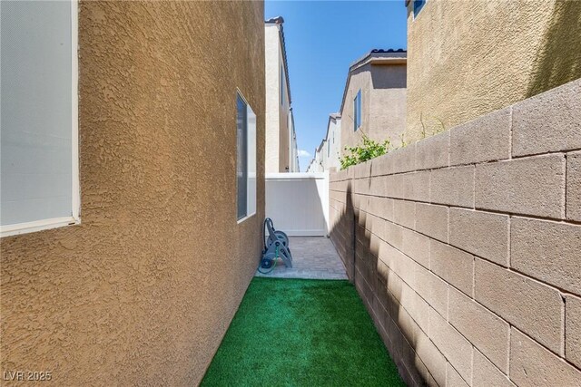 7694 Hampton Park Ln, Las Vegas, NV 89113 - view of side of property with stucco siding