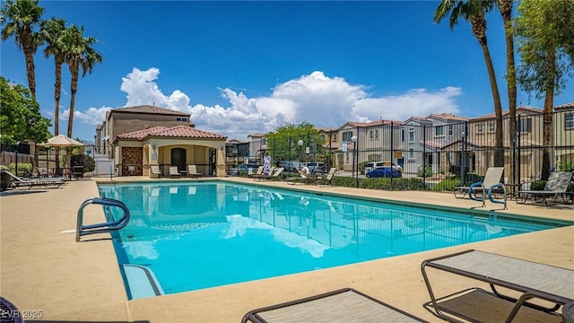 7694 Hampton Park Ln, Las Vegas, NV 89113 - community pool featuring a residential view and a patio