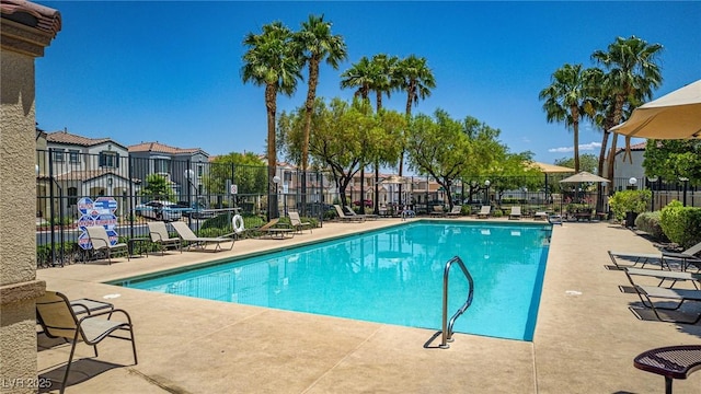 7694 Hampton Park Ln, Las Vegas, NV 89113 - community pool with a patio area and a residential view
