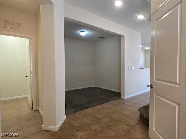 9312 Gold Dove Ct, Las Vegas, NV 89178 - hall with tile patterned floors, baseboards, and carpet floors
