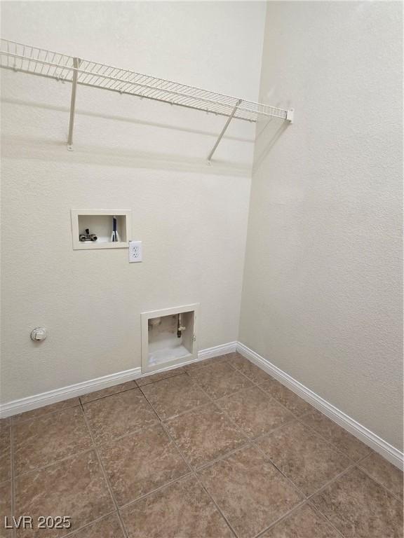 9312 Gold Dove Ct, Las Vegas, NV 89178 - laundry area featuring washer hookup, baseboards, and tile patterned floors