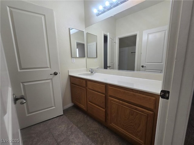9312 Gold Dove Ct, Las Vegas, NV 89178 - bathroom with vanity, tile patterned flooring, and baseboards