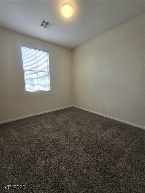 9312 Gold Dove Ct, Las Vegas, NV 89178 - empty room featuring baseboards and dark colored carpet
