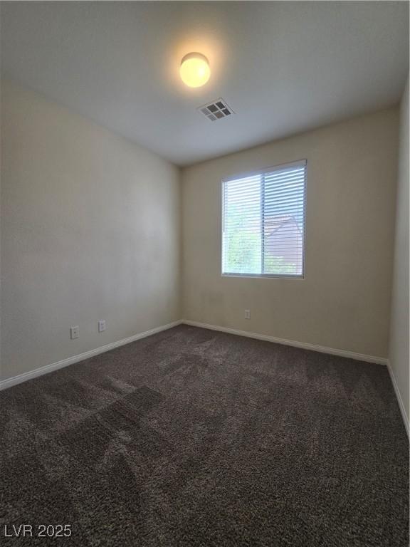 9312 Gold Dove Ct, Las Vegas, NV 89178 - unfurnished room with dark colored carpet and baseboards
