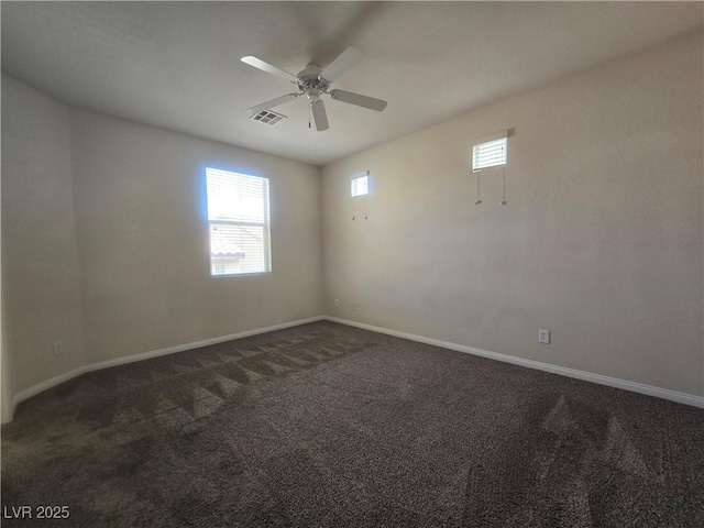 9312 Gold Dove Ct, Las Vegas, NV 89178 - empty room featuring dark carpet, a ceiling fan, and baseboards