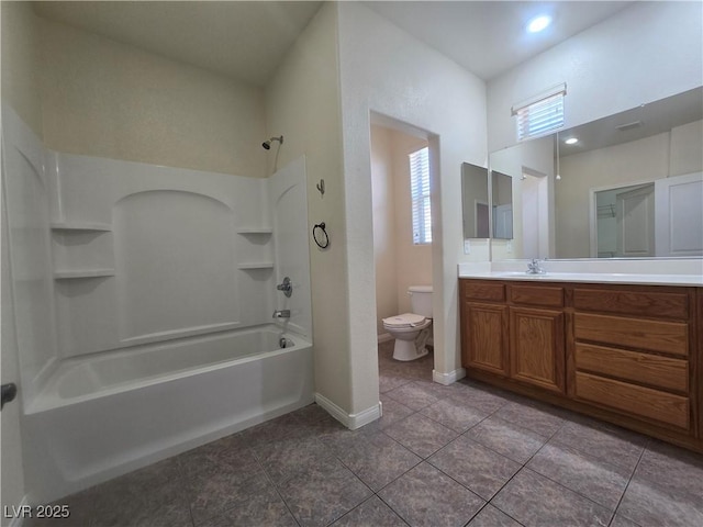 9312 Gold Dove Ct, Las Vegas, NV 89178 - bathroom featuring tile patterned flooring, toilet, vanity,  shower combination, and baseboards