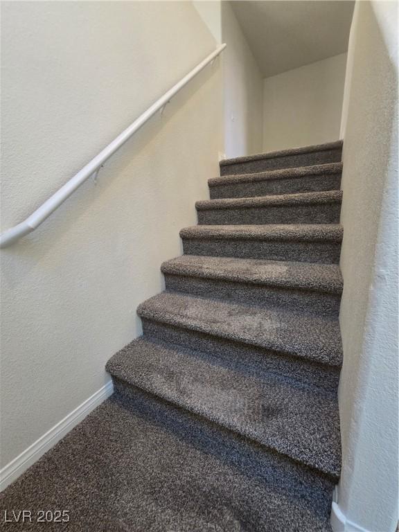 9312 Gold Dove Ct, Las Vegas, NV 89178 - stairway featuring baseboards and carpet floors