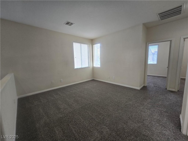 9312 Gold Dove Ct, Las Vegas, NV 89178 - empty room featuring dark colored carpet and baseboards