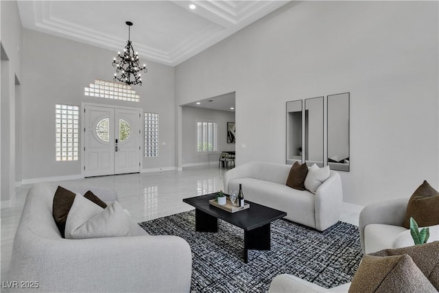 7738 Willow Cove Cir, Las Vegas, NV 89129 - living area with a chandelier, a high ceiling, and baseboards