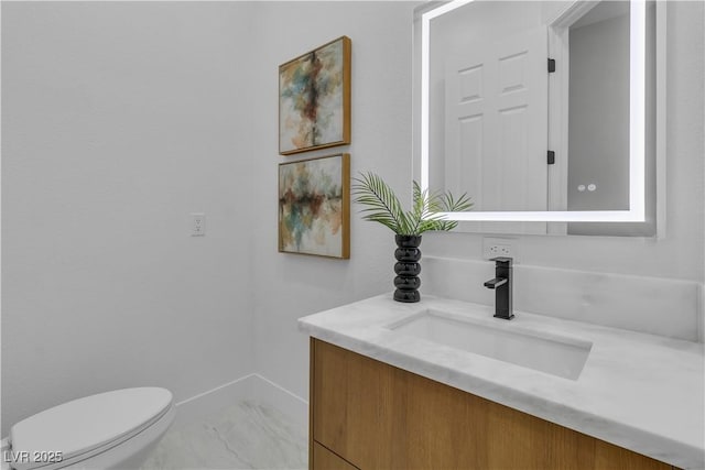 7738 Willow Cove Cir, Las Vegas, NV 89129 - bathroom featuring vanity, toilet, and marble finish flooring