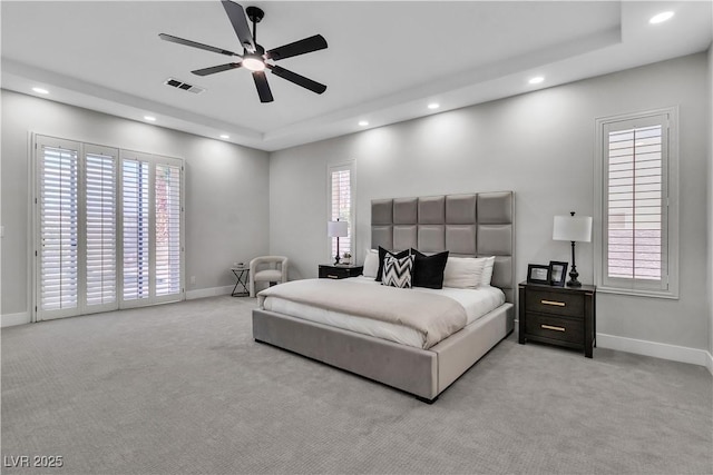 7738 Willow Cove Cir, Las Vegas, NV 89129 - bedroom featuring recessed lighting, light carpet, a tray ceiling, and baseboards