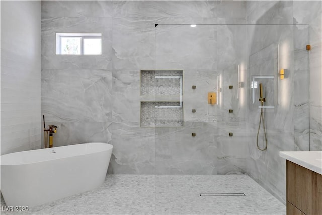7738 Willow Cove Cir, Las Vegas, NV 89129 - bathroom featuring a soaking tub, vanity, a marble finish shower, and tile walls