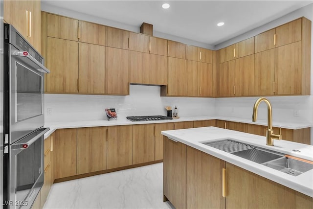 7738 Willow Cove Cir, Las Vegas, NV 89129 - kitchen featuring a sink, appliances with stainless steel finishes, light countertops, light marble finish floors, and recessed lighting