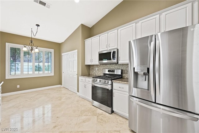 8541 Highland View Ave, Las Vegas, NV 89145 - kitchen with stainless steel appliances, lofted ceiling, tasteful backsplash, white cabinets, and a chandelier