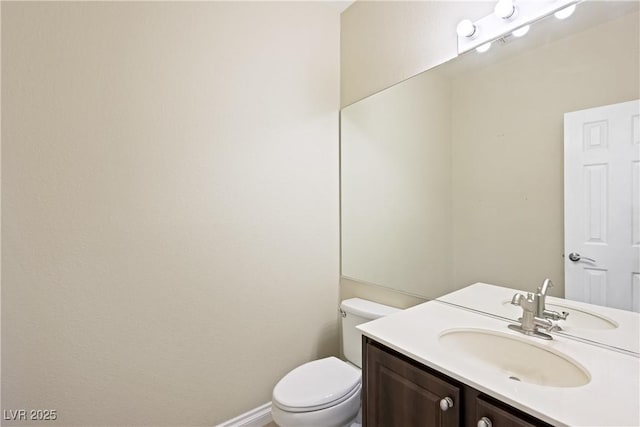 8541 Highland View Ave, Las Vegas, NV 89145 - bathroom featuring vanity, toilet, and baseboards