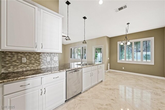 8541 Highland View Ave, Las Vegas, NV 89145 - kitchen featuring dishwasher, a sink, white cabinetry, and backsplash