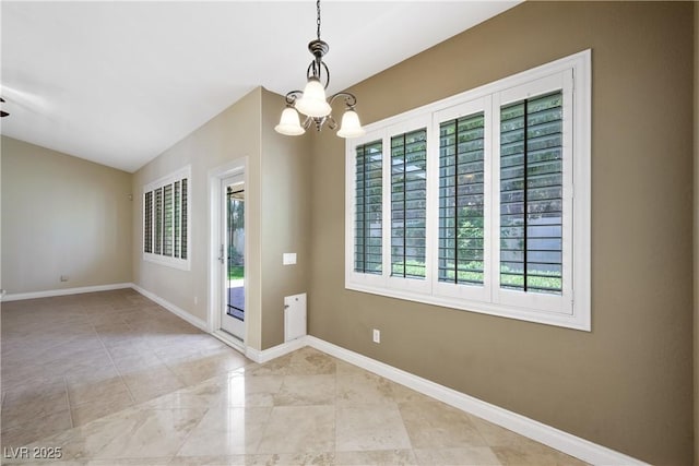 8541 Highland View Ave, Las Vegas, NV 89145 - spare room featuring a chandelier, baseboards, and lofted ceiling