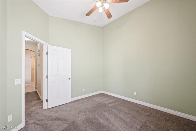 8541 Highland View Ave, Las Vegas, NV 89145 - unfurnished bedroom with carpet flooring, baseboards, arched walkways, and ceiling fan