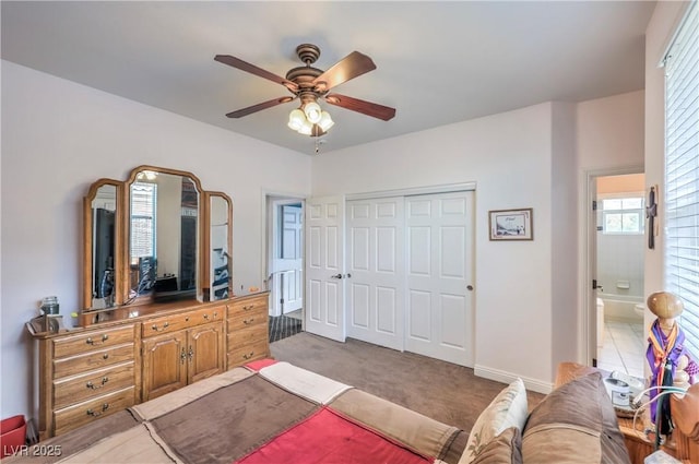 2982 Hammerwood Dr, Las Vegas, NV 89135 - bedroom featuring a closet, ceiling fan, light colored carpet, and baseboards