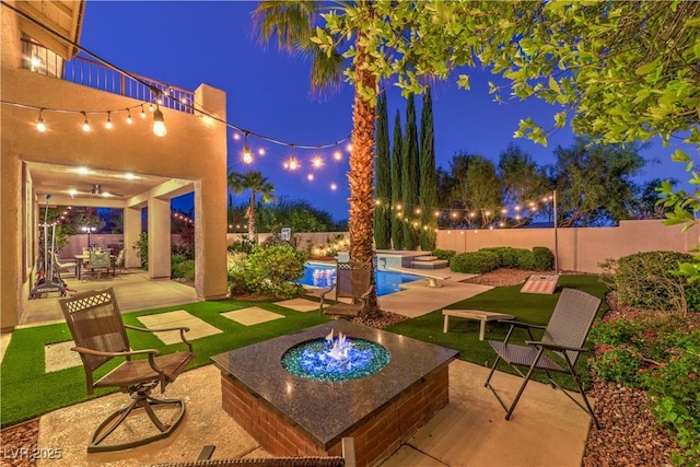 2982 Hammerwood Dr, Las Vegas, NV 89135 - patio at night featuring a patio area and a fenced backyard