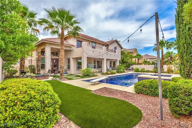 2982 Hammerwood Dr, Las Vegas, NV 89135 - back of house with a balcony, stucco siding, and a patio area
