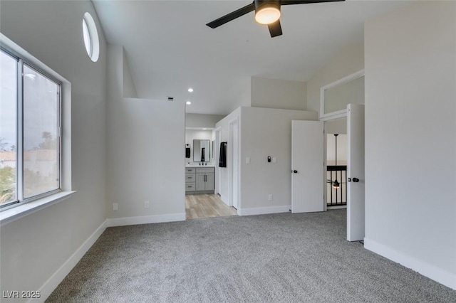 71 Sea Holly Way, Henderson, NV 89074 - unfurnished living room featuring light carpet, ceiling fan, baseboards, and recessed lighting