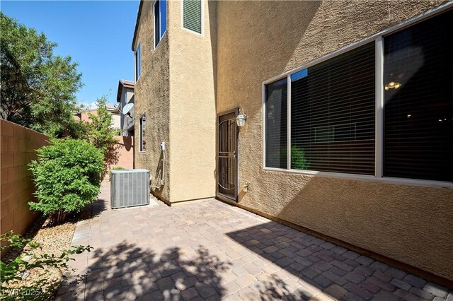10449 Yew Blossom Ave, Las Vegas, NV 89166 - fenced backyard with central air condition unit and a patio area