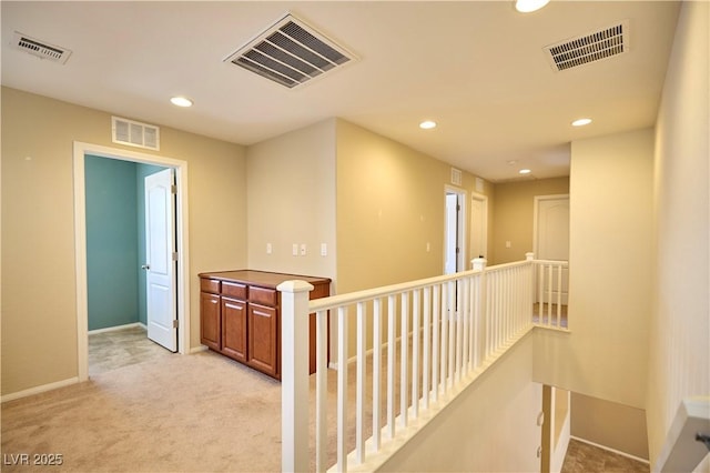 10449 Yew Blossom Ave, Las Vegas, NV 89166 - hallway with recessed lighting, an upstairs landing, light carpet, and baseboards