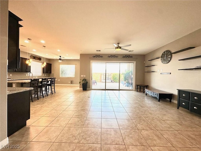 10719 Hammett Park Ave, Las Vegas, NV 89166 - living area featuring a ceiling fan, light tile patterned flooring, recessed lighting, and baseboards
