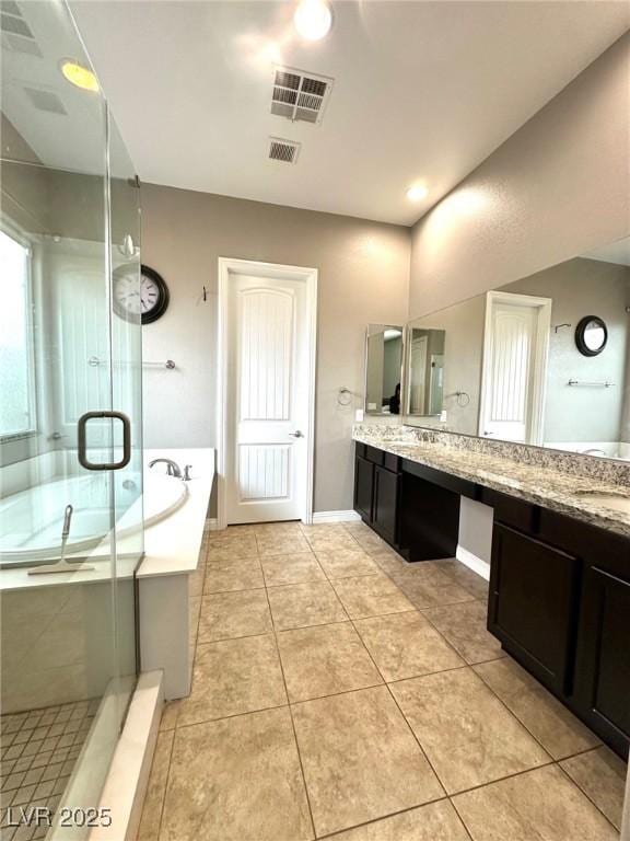 10719 Hammett Park Ave, Las Vegas, NV 89166 - full bathroom with a bath, vanity, a stall shower, and tile patterned flooring