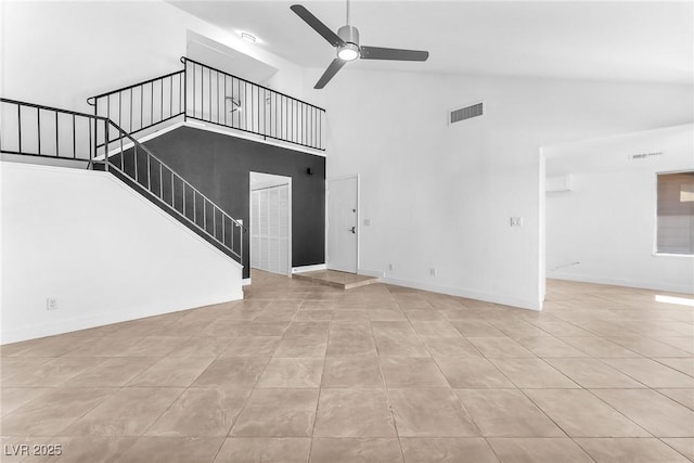 6717 Sheffield Dr, Las Vegas, NV 89108 - unfurnished living room with high vaulted ceiling, a ceiling fan, stairs, and tile patterned flooring