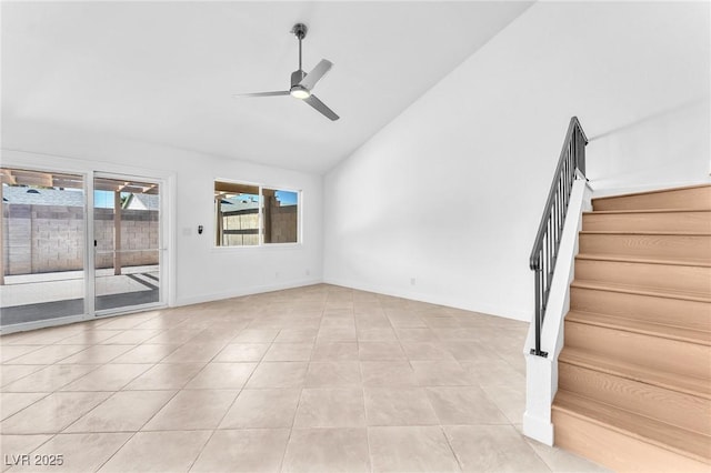6717 Sheffield Dr, Las Vegas, NV 89108 - empty room with stairs, a ceiling fan, high vaulted ceiling, and light tile patterned flooring