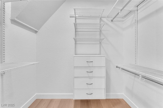 6717 Sheffield Dr, Las Vegas, NV 89108 - spacious closet with light wood finished floors