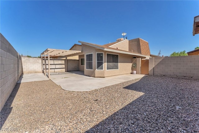 6717 Sheffield Dr, Las Vegas, NV 89108 - back of property with stucco siding, a fenced backyard, and a patio area