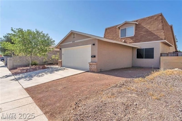 6717 Sheffield Dr, Las Vegas, NV 89108 - view of side of home featuring stucco siding, concrete driveway, an attached garage, and a shingled roof