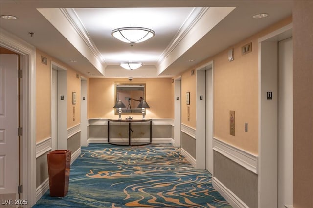 145 E Harmon Ave Unit 1120, Las Vegas, NV 89109 - hall with carpet flooring, a tray ceiling, elevator, a wainscoted wall, and crown molding