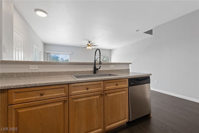 9312 Straw Hays St Unit 103, Las Vegas, NV 89178 - kitchen featuring dishwasher, a ceiling fan, brown cabinetry, dark wood-type flooring, and light countertops
