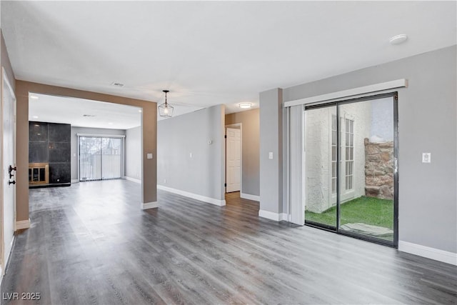 3971 Foxboro Cir, Las Vegas, NV 89121 - unfurnished living room featuring wood finished floors and baseboards