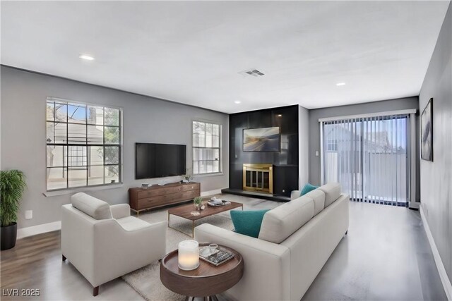 3971 Foxboro Cir, Las Vegas, NV 89121 - living room with baseboards, wood finished floors, and recessed lighting