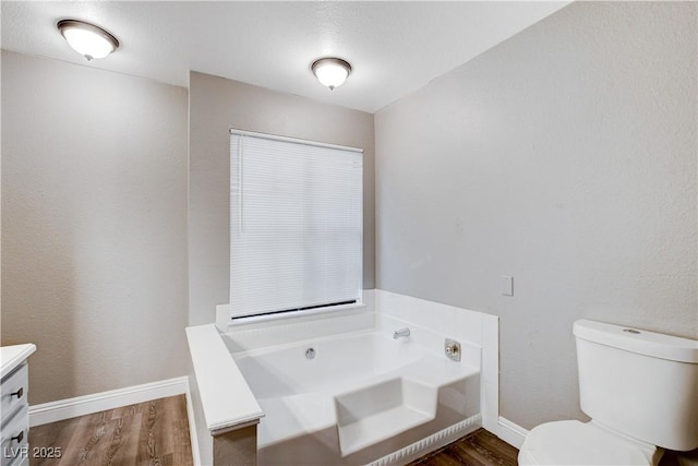 3971 Foxboro Cir, Las Vegas, NV 89121 - bathroom with vanity, wood finished floors, a garden tub, and baseboards